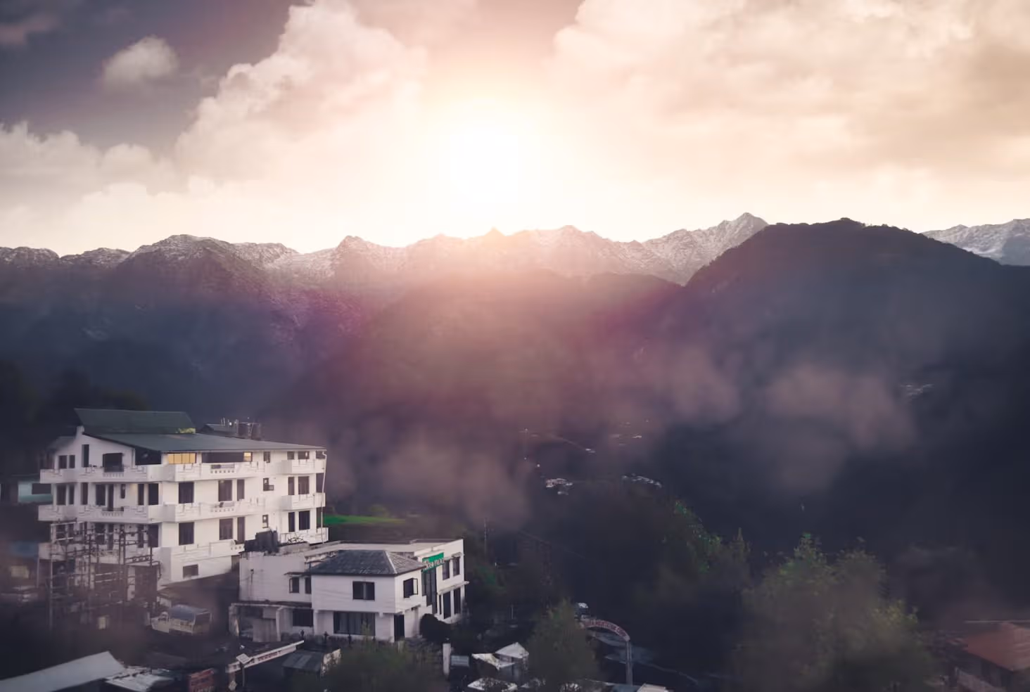 Misty Himalayan hills around a wooden mountain lodge